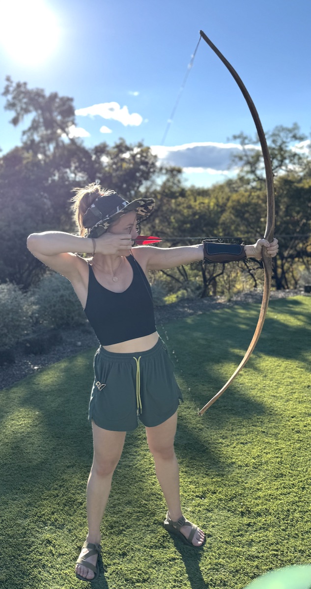 Drawing a bow, top-knot out