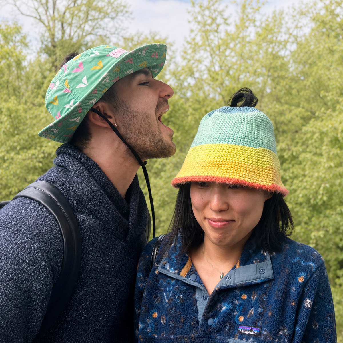 A couple in HolyHats outdoors